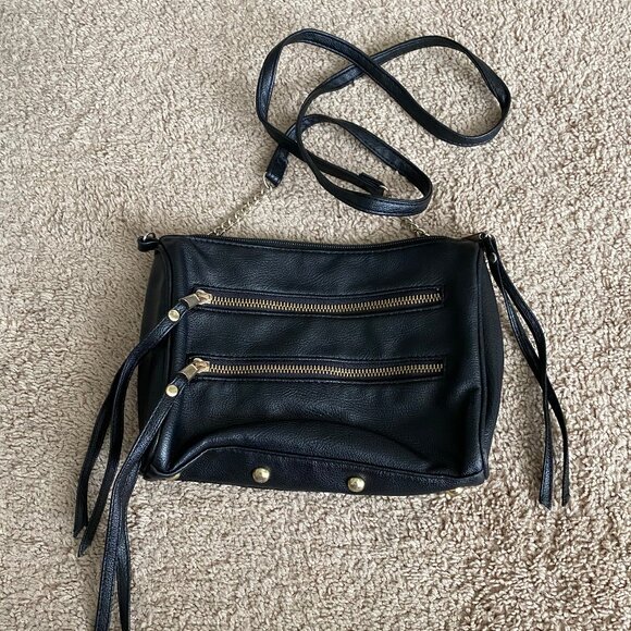 Handbags - Black leather crossbody bag with gold zippers and hardware.